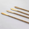 Hand forged solid brass cocktail stirrers with hammered stem and feather patterned end.
