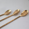 Hand forged solid brass cocktail stirrers in various lengths, handmade in Maine. With hammered stem, feather patterned end, and forged stirrer spoon. 